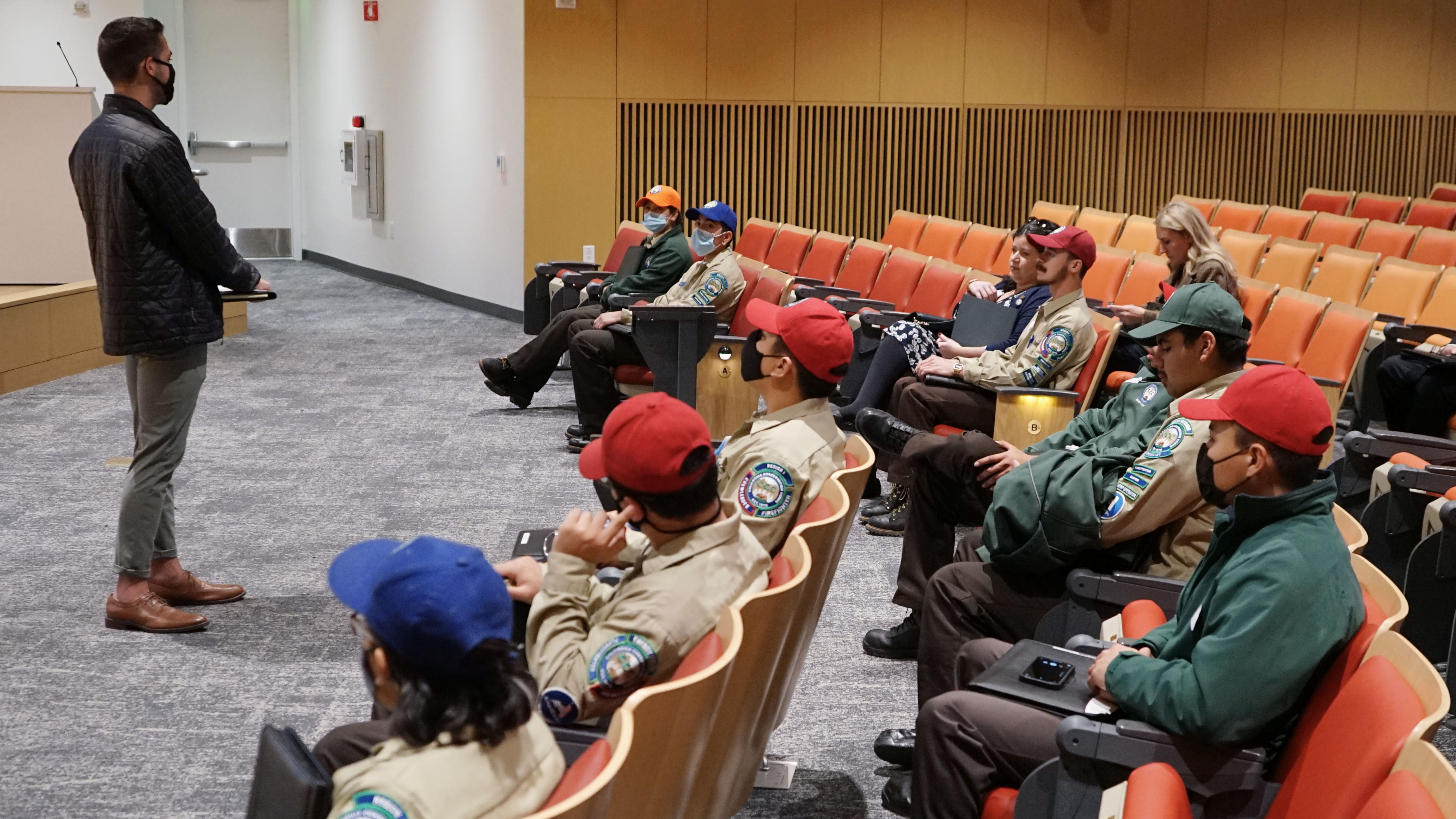 Group of Conservation Corp members sit in new CNRA Headquarters Auditorium