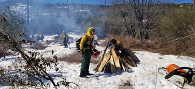 Native American Conservation Corps members conducting pile burn in the Cuyamaca Rancho State Park