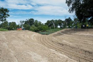 Photo 1: The newly excavated channel from the Sacramento River to the Fremont Weir and the upgraded fish passage structure. Photo courtesy of Department of Water Resources (Kelly M. Grow)