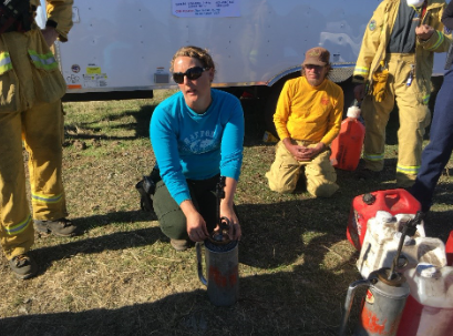 Lenya Quinn-Davidson, UC ANR Fire Advisor demonstrates how to fill and use a drip torch at a prescribed burn association event.