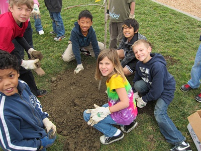 Photo of children planting tree