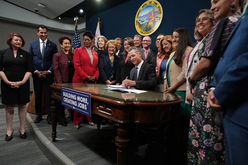 Governor Newsom signing a bill