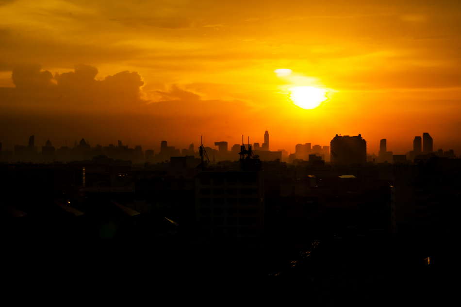 image of a sunset through a city skyline