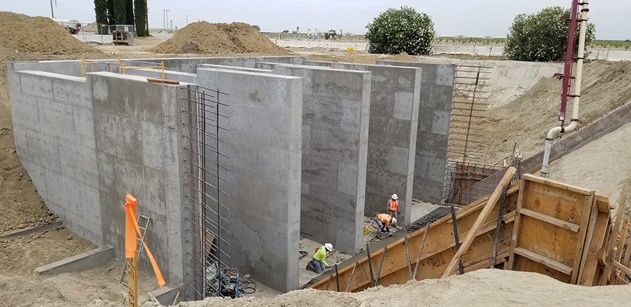 Work progresses on the construction of a pumping station that will house four 450-horsepower pumps capable of pumping a total of 500 cubic feet/second into canals heading north and east.
