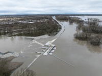 A drone photo shows the Fremont Weir along the Sacramento River overtopping in the wake of an atmospheric river in California. Photo taken February 6, 2024.