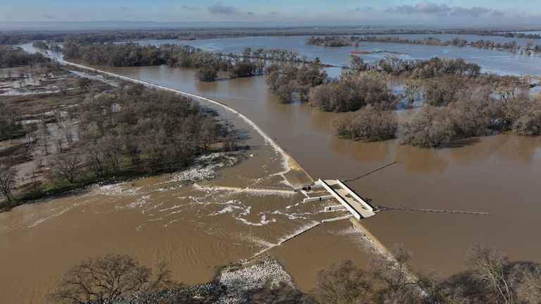 Rain swells the Sacramento River and overtops the Fremont Weir. Photo taken Dec. 29, 2025