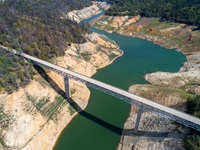 An aerial drone view showing low water under the Enterprise Bridge at Lake Oroville with a water elevation of 743 feet on March 17, 2022.