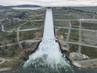 A drone provides an aerial view of the California Department of Water Resources first 2024 water release from the Lake Oroville flood control gates down the 3,000-foot main spillway in Butte County, California. Main spillway releases will continue to manage lake levels in anticipation of rain and snowmelt. Photo taken January 31, 2024.