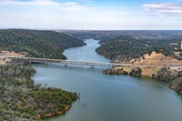 An aerial view shows high water conditions at West Branch Feather River Bridge located near the Lime Saddle Marina at Lake Oroville in Butte County, California. Photo taken June 12, 2023.