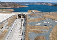 A drone view of workers performing maintenance on the spillway of the  Oroville Dam located at Lake Oroville in Butte County, California.