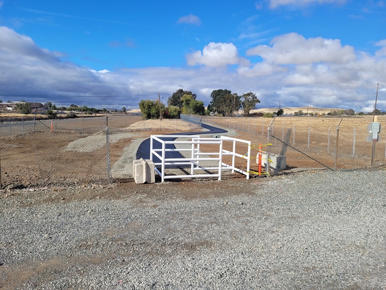 Newly installed white, box-style gates provide access to the Brad Freeman Trail between Cherokee Road and Garden Drive