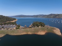 A drone view of the Historic Bidwell Bar Bridge and Lake Oroville in Butte County, California.