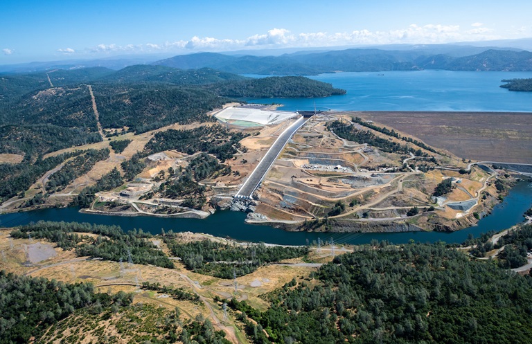 An aerial overview of Lake Oroville and the reconstructed Lake Oroville main spillway and emergency spillway at the Butte County, California site.