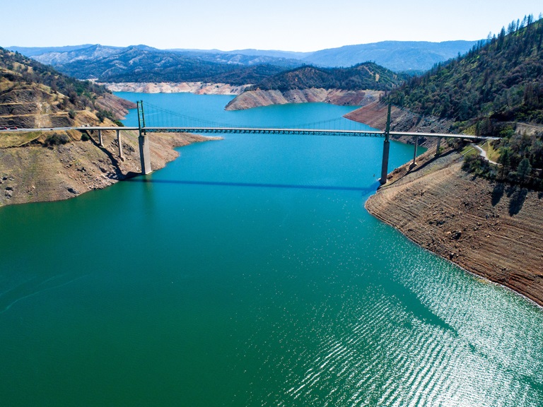 An aerial drone view showing Bidwell Bar Bridge across Lake Oroville. The lake is at an elevation of 728 feet, 42 percent of total capacity or 51 percent of average capacity for this time or year, on May 4, 2021 in Butte County, California.