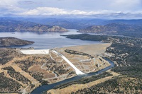 An aerial view of Lake Oroville taken June 12 when the reservoir was at its full capacity. Water is being releases from Oroville Dam to the Feather River from the main spillway. 