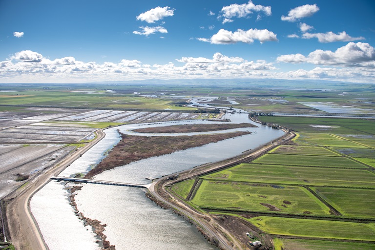 Aerial view looking south at the S Bacon Island road bridge over Middle River connecting the eastern side of Bacon Island (right) and Jones Tract, both part of the Sacramento-San Joaquin River Delta in San Joaquin County, California.