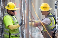 Workers construct a stay-form that will hold leveling concrete in place on the upper chute of the Lake Oroville main spillway in Butte County, 