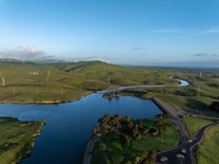 A drone view of the Bethany Reservoir, impounded by five dams in Alameda County, serves as a forebay for the South Bay Pumping Plant and afterbay for Banks Pumping Plant.