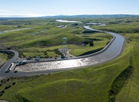 A drone provides a view of water pumped from the Harvey O. Banks Delta Pumping Plant into the California Aqueduct at 9,790 cubic feet per second after January storms. Photo taken January 20, 2023.